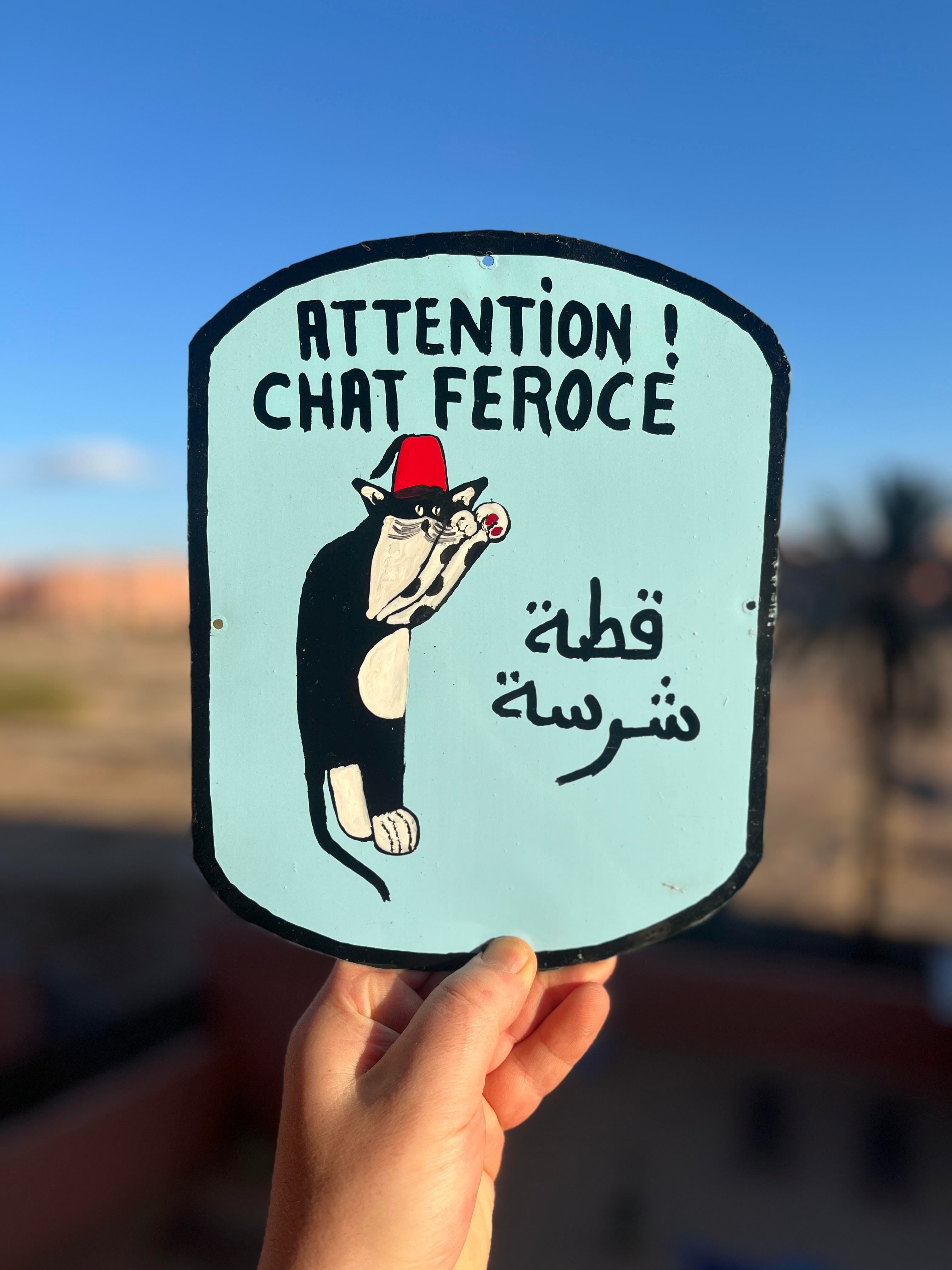 Chat Feroce wearing a fez - Moroccan tin sign